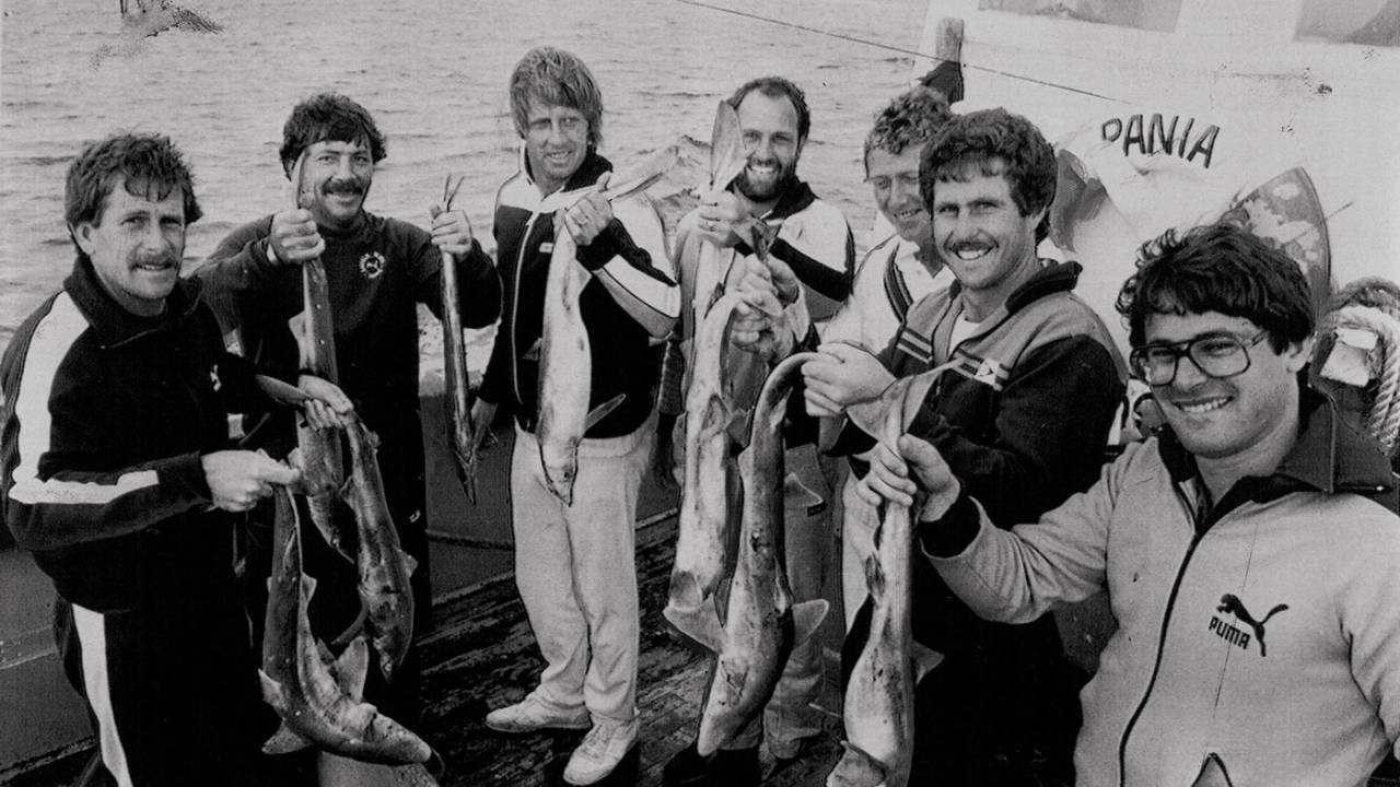 Bruce Laird, Rod Marsh, Jeff Thomson, Ray Bright, Kim Hughes, Grame Wood and the team masseur show off the catch they got at Cape Saunders, February 1982