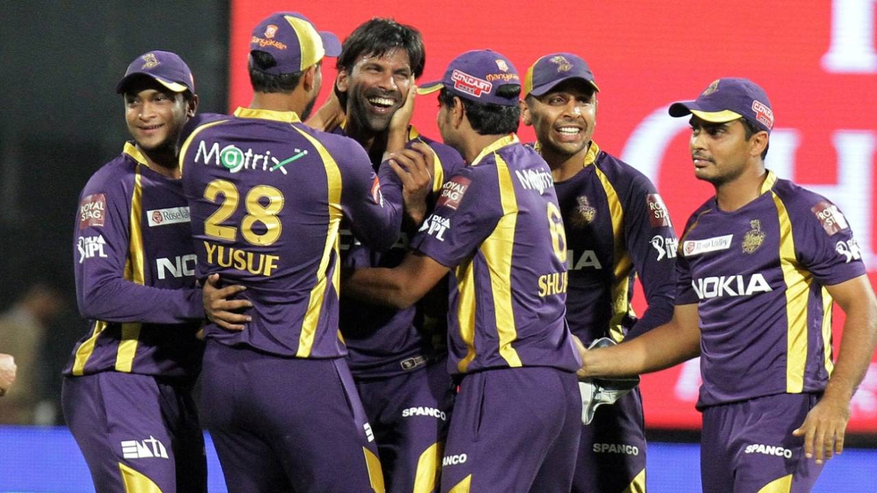 The Kolkata Knight Riders players celebrate a wicket, Bengaluru, April 10, 2012