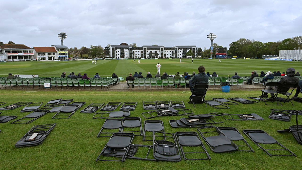 Spectators watch the action among chairs blown over in the wind, Kent vs Glamorgan, LV= Insurance Championship, Canterbury, 2nd day, May 21, 2021