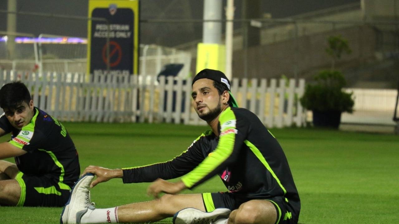 Zaid Alam stretches during a training session
