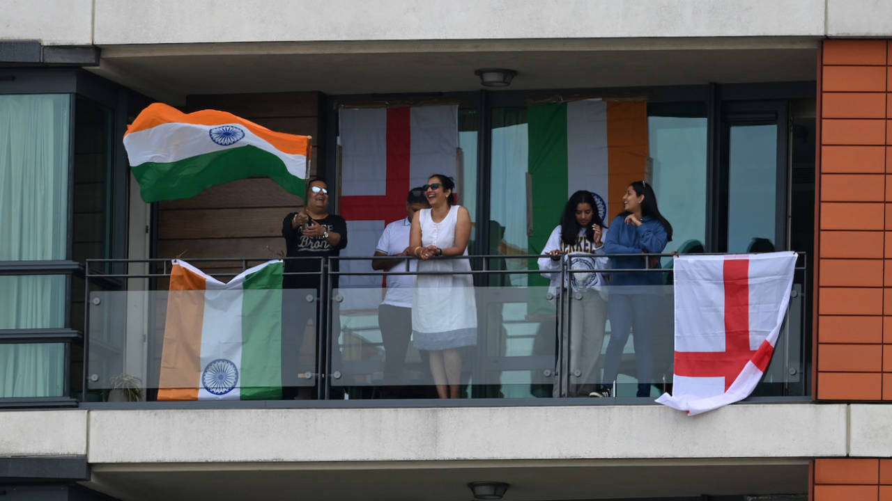 A group of fans watches the Lord's Test from an apartment across the road from the ground, England vs India, 2nd Test, Lord's, London, 3rd day, August 14, 2021