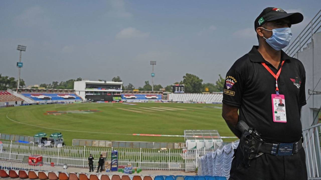 A securityperson stands guard at the Rawalpindi Cricket Stadium, Rawalpindi, September 17, 2021