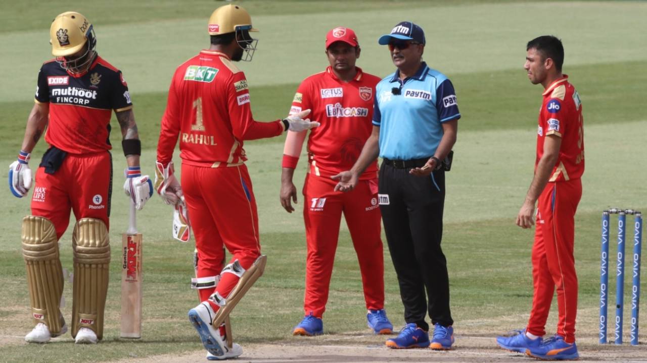 KL Rahul speaks with umpire KN Ananthapadmanabhan after a DRS call against Devdutt Padikkal was turned down, Royal Challengers Bangalore vs Punjab Kings, IPL 2021, Sharjah, October 3, 2021