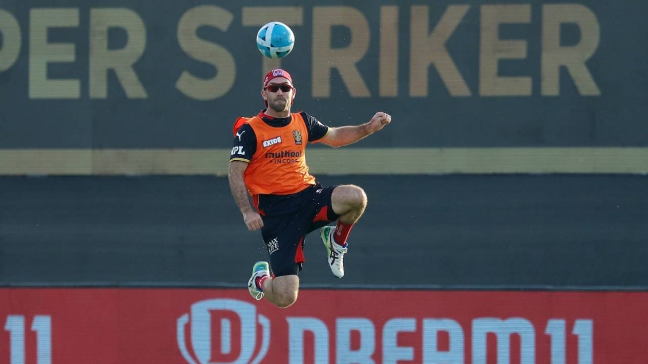 Glenn Maxwell plays with a football during warm-up, Royal Challengers Bangalore vs Sunrisers Hyderabad, IPL 2021, Abu Dhabi, October 6, 2021
