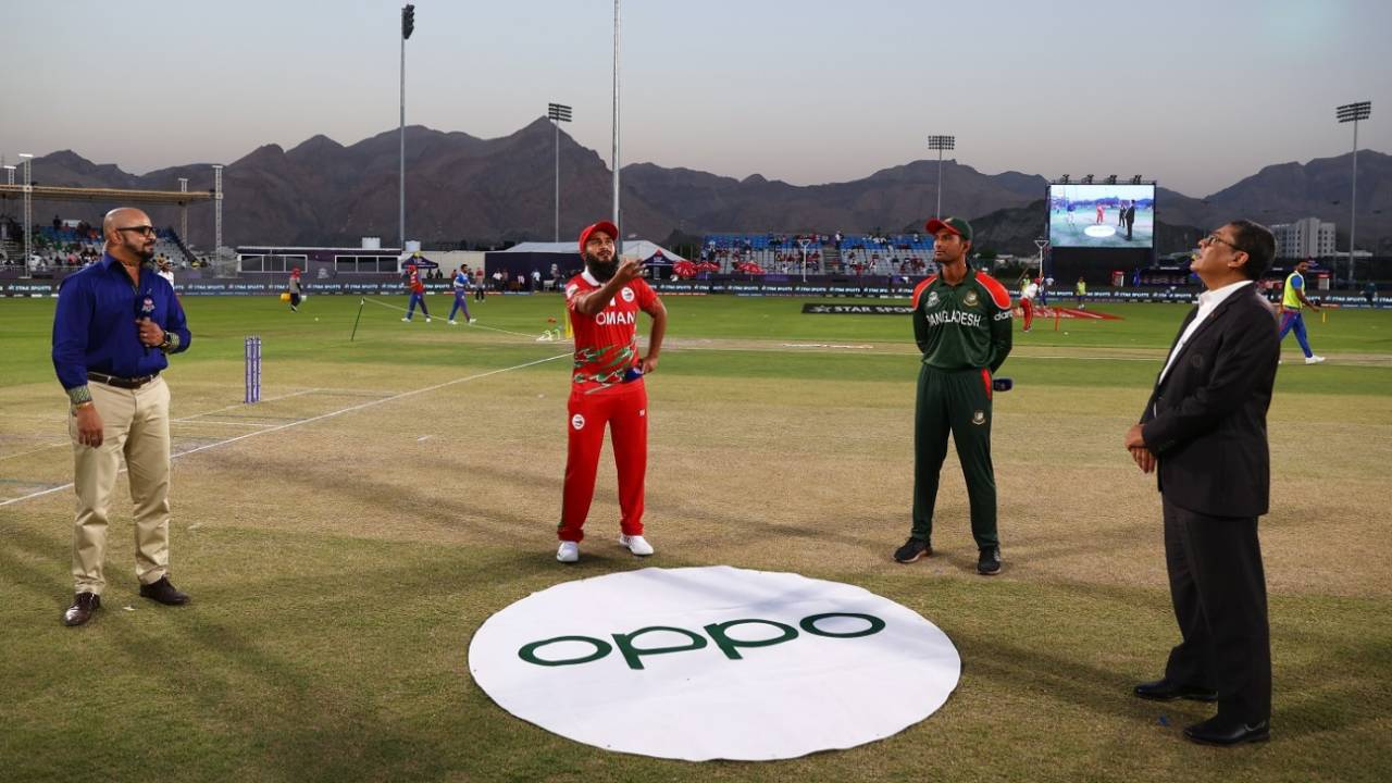 Zeeshan Maqsood and Mahmudullah at the toss, as commentator Murali Kartik and match referee Ranjan Madugalle look on, Oman vs Bangladesh, T20 World Cup, Al Amerat, October 19, 2021
