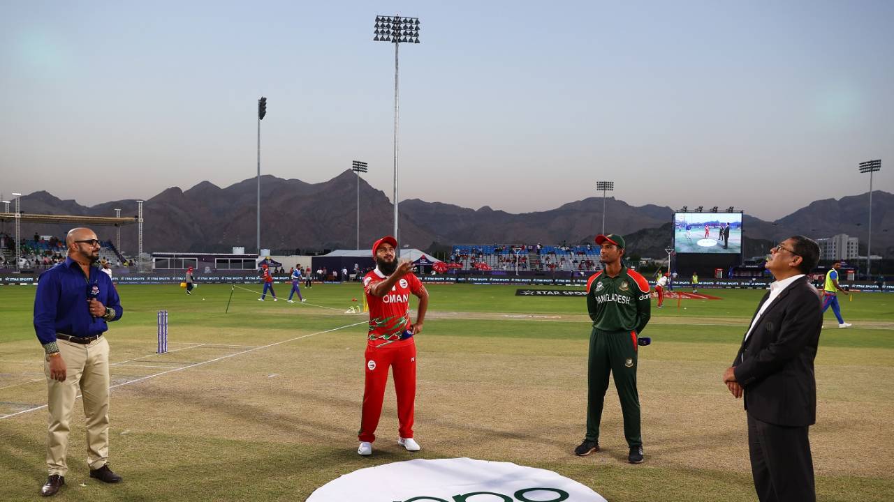 Zeeshan Maqsood and Mahmudullah at the toss, as commentator Murali Kartik and match referee Ranjan Madugalle look on, Oman vs Bangladesh, T20 World Cup, Al Amerat, October 19, 2021