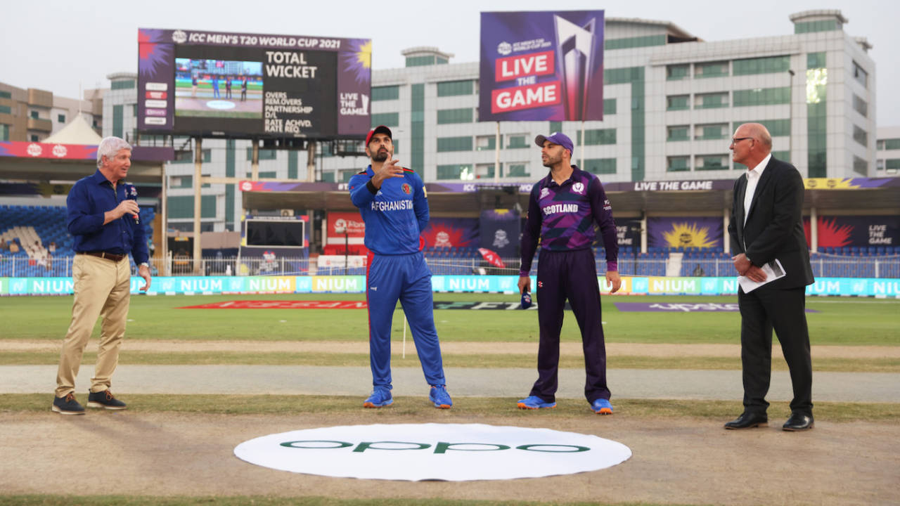 Alan Wilkins, Kyle Coetzer and Jeff Crowe watch as Mohammad Nabi flips the coin, Afghanistan vs Scotland, T20 World Cup 2021, Group 2, Sharjah, October 25, 2021