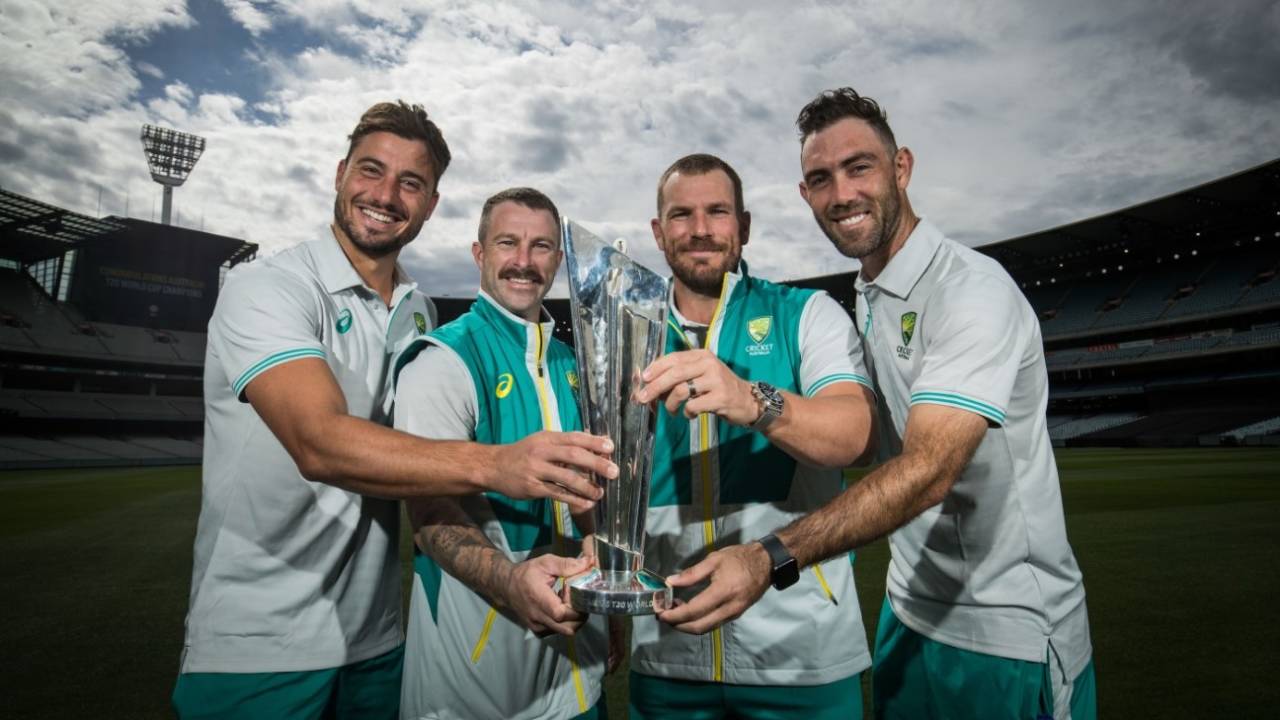 Marcus Stoinis, Matthew Wade, Aaron Finch and Glenn Maxwell pose with the T20 World Cup trophy at the MCG