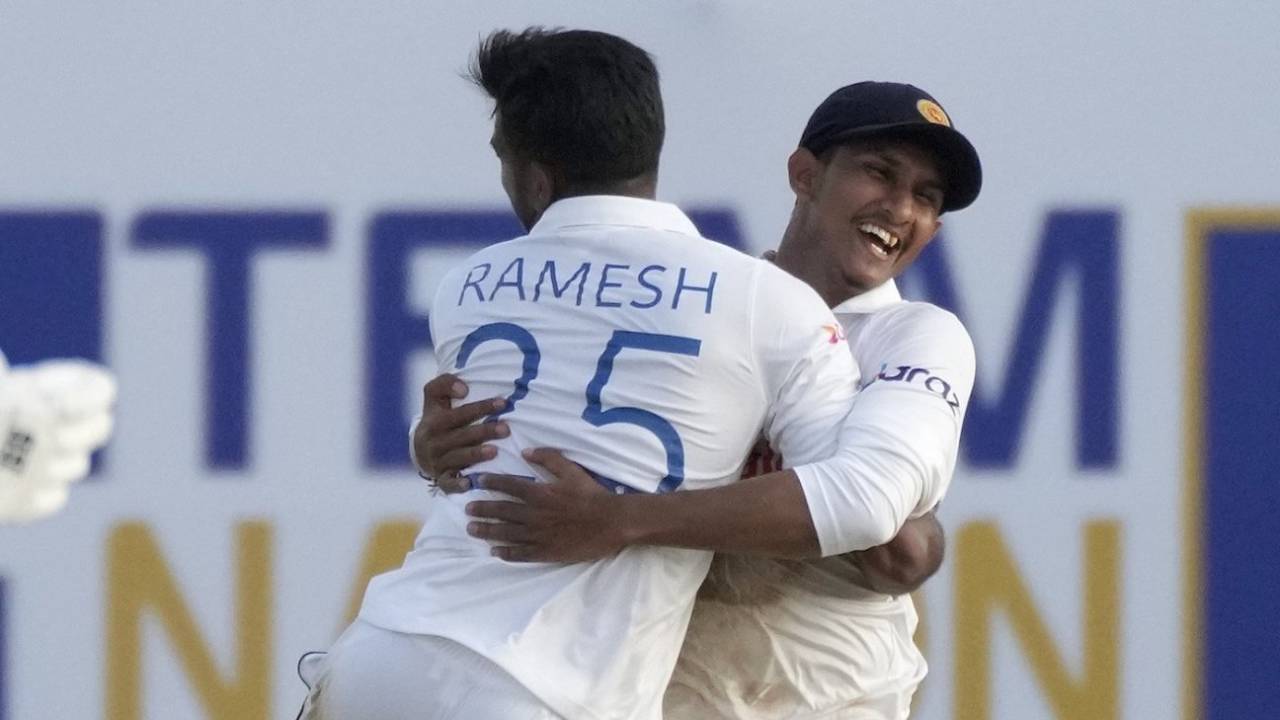Ramesh Mendis is embraced by Praveen Jayawickrama after a wicket&nbsp;&nbsp;&bull;&nbsp;&nbsp;AFP/Getty Images