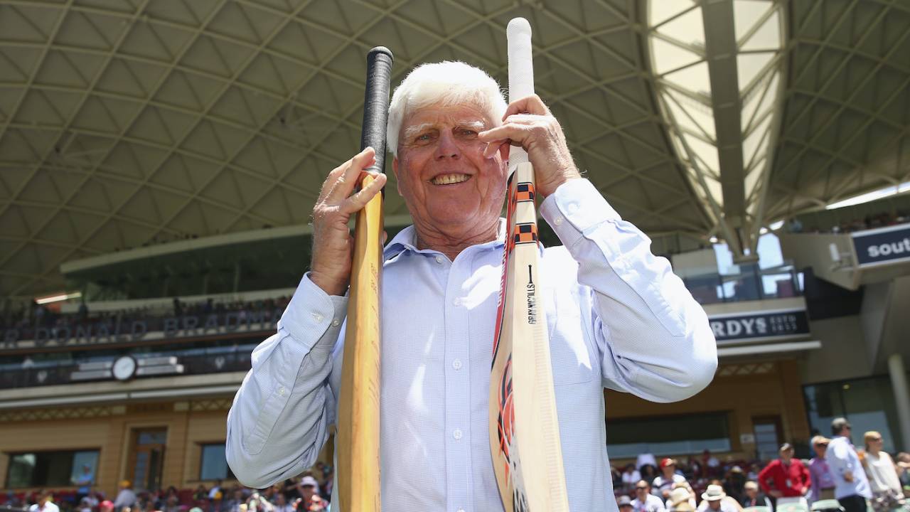 Barry Richards holds the bat with which he made 325 in a day at the WACA in 1970 in his right hand, and David Warner's modern-day weapon in his left
