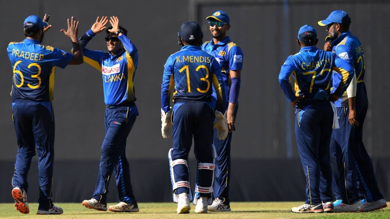 Jeffrey Vandersay celebrates a wicket with team-mates, Sri Lanka vs Zimbabwe, 1st ODI, Pallekele, January 16, 2022