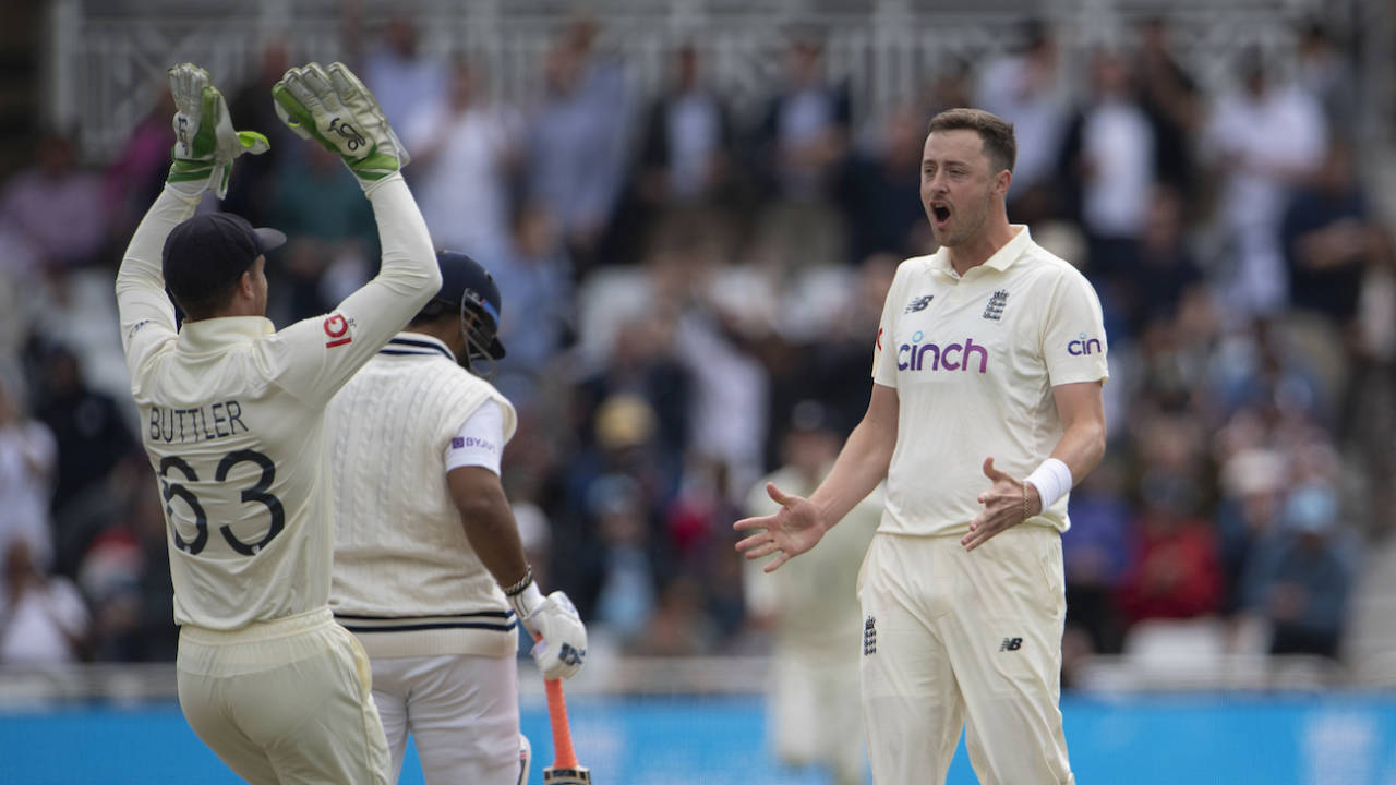 Jos Buttler and Ollie Robinson celebrate the wicket of Rishabh Pant, England v India, first Test, Trent Bridge, day two, August 5, 2021