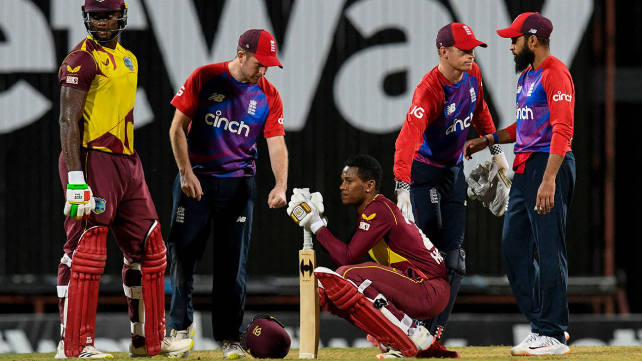 Liam Dawson, Sam Billings and Adil Rashid console Akeal Hosein and Romario Shepherd, West Indies vs England, 2nd T20I, Kensington Oval, Barbados, January 23, 2022