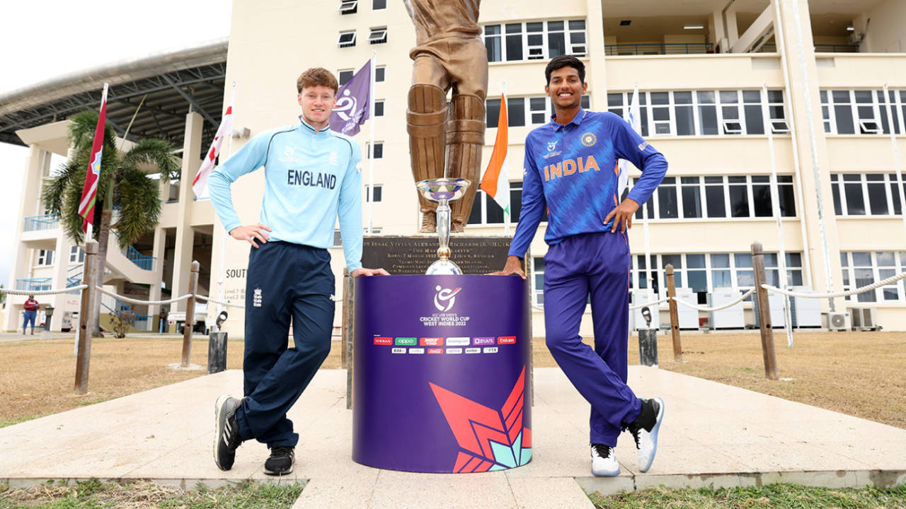 Tom Prest and Yash Dhull pose with the U19 World Cup in front of the stature of Viv Richards, Antigua, February 4, 2022