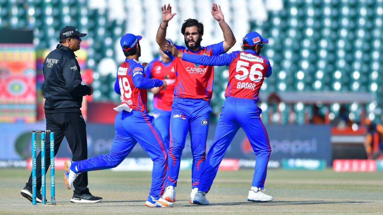 Usman Shinwari is mobbed by team-mates after picking up a wicket, Quetta Gladiators vs Karachi Kings, PSL 2022, Lahore, February 20, 2022