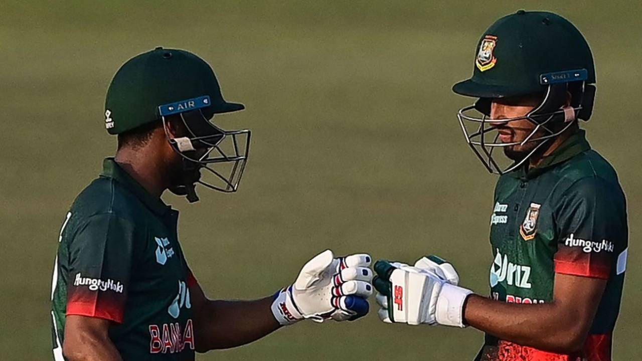 Afif Hossain (R) bumps fists with Mehidy Hasan Miraz during their partnership for the seventh wicket, Bangladesh vs Afghanistan, 1st ODI, Chattogram, February 23, 2022