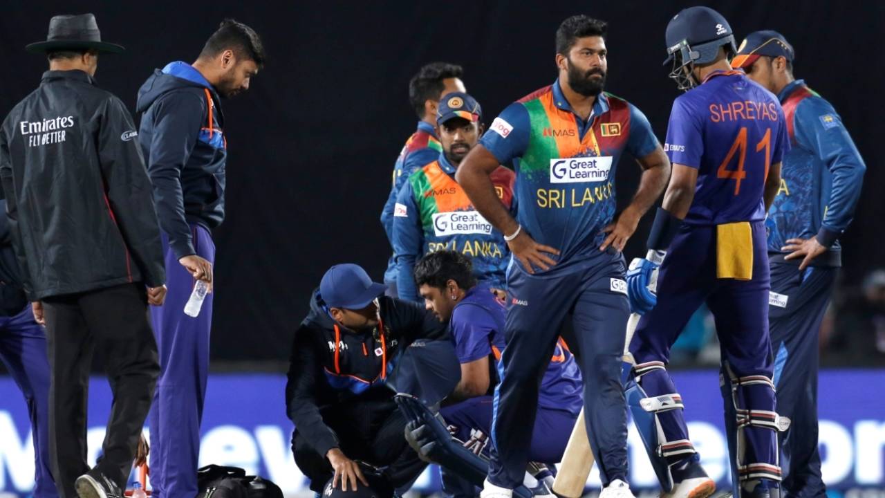 Ishan Kishan gets attention from the physio after being struck on the helmet, India vs Sri Lanka, 2nd T20I, Dharamsala, February 26, 2022