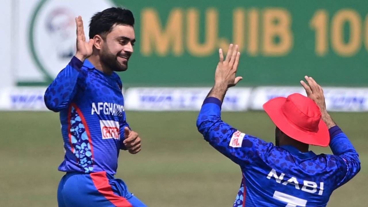Rashid Khan celebrates Yasir Ali's wicket with Mohammad Nabi, Bangladesh vs Afghanistan, 3rd ODI, Chattogram, February 28, 2022