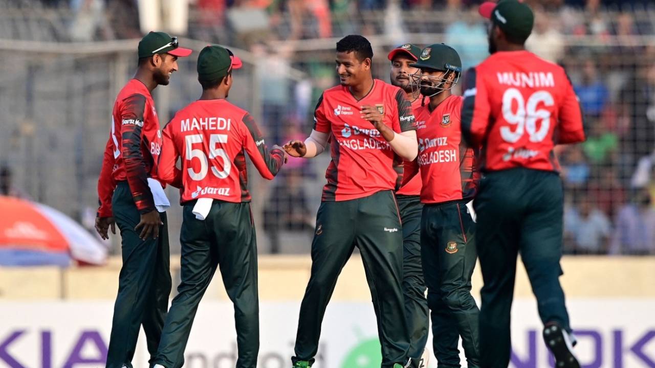 Nasum Ahmed is mobbed by his team-mates after dismissing a batter, Bangladesh vs Afghanistan, 1st T20I, Dhaka, March 3, 2022