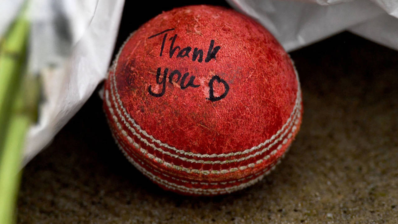 A signed cricket ball left by fans at Shane Warne's MCG statue&nbsp;&nbsp;&bull;&nbsp;&nbsp;AFP