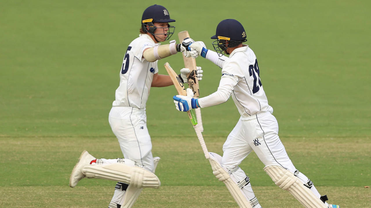Mitch Perry (left) and Todd Murphy punch gloves as the winning runs are scored&nbsp;&nbsp;&bull;&nbsp;&nbsp;Getty Images