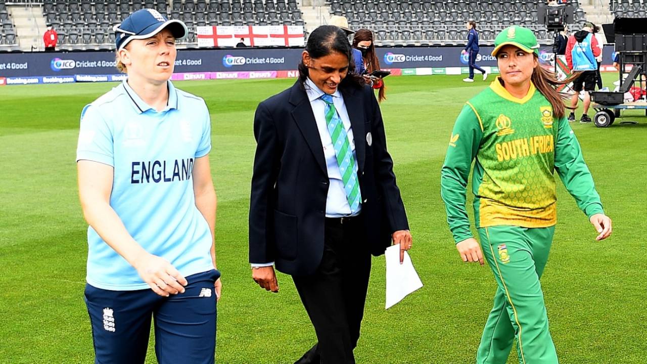 Captains Heather Knight and Sune Luus walk out for the toss with match referee GS Lakshmi, South Africa vs England, Women's World Cup 2022, 2nd semi-final, March 31, 2022