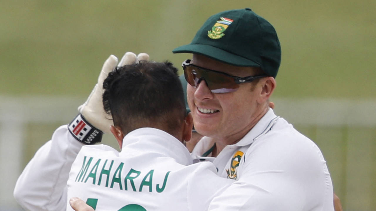 Keshav Maharaj and Simon Harmer celebrate a wicket, Durban, April 4, 2022