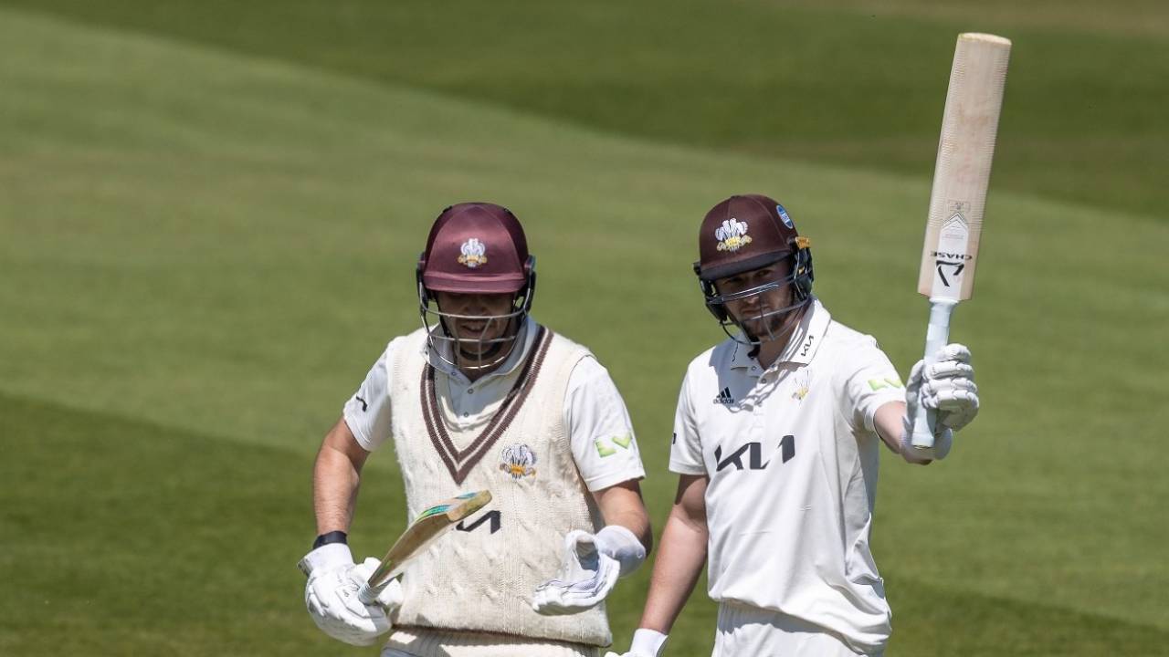 Gus Atkinson acknowledges the applause on reaching his maiden first-class half-century alongside team-mate Jamie Overton, Surrey vs Northamptonshire, LV= Insurance Championship, Division One, Kia Oval, 2nd day, May 6, 2022