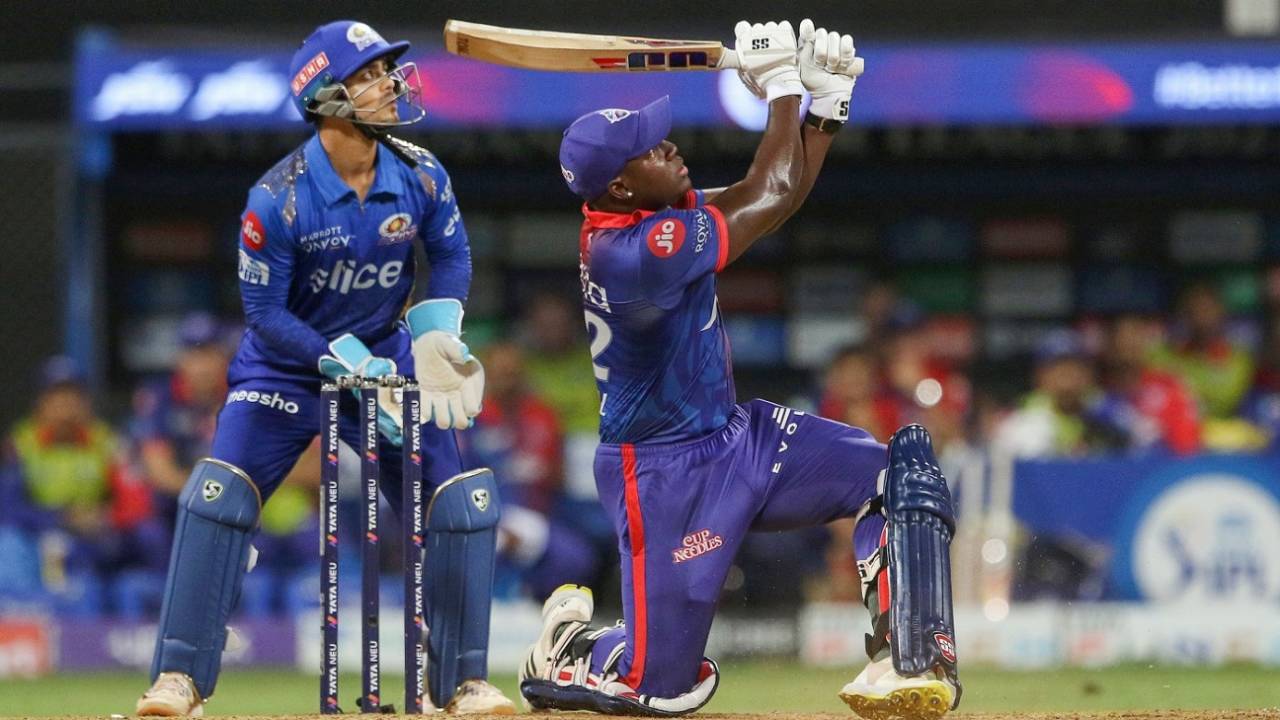 Rovman Powell hits one off Hrithik Shokeen into the night sky, Mumbai Indians vs Delhi Capitals, IPL 2022, Wankhede Stadium, Mumbai, May 21, 2022