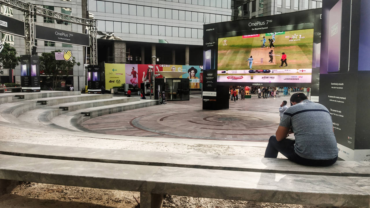 A fan watches the World Cup final on a giant screen in Delhi, July 14, 2019