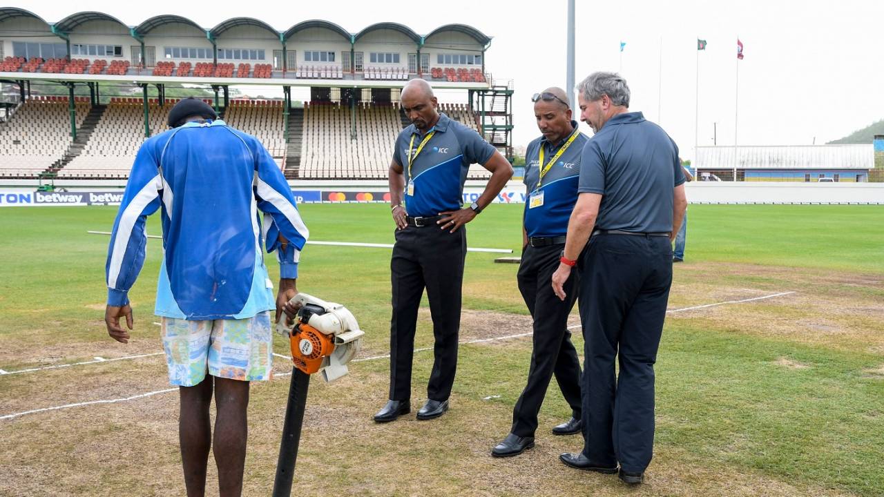 Match officials Joel Wilson, Gregory Brathwaite and Richard Illingworth inspect the surface