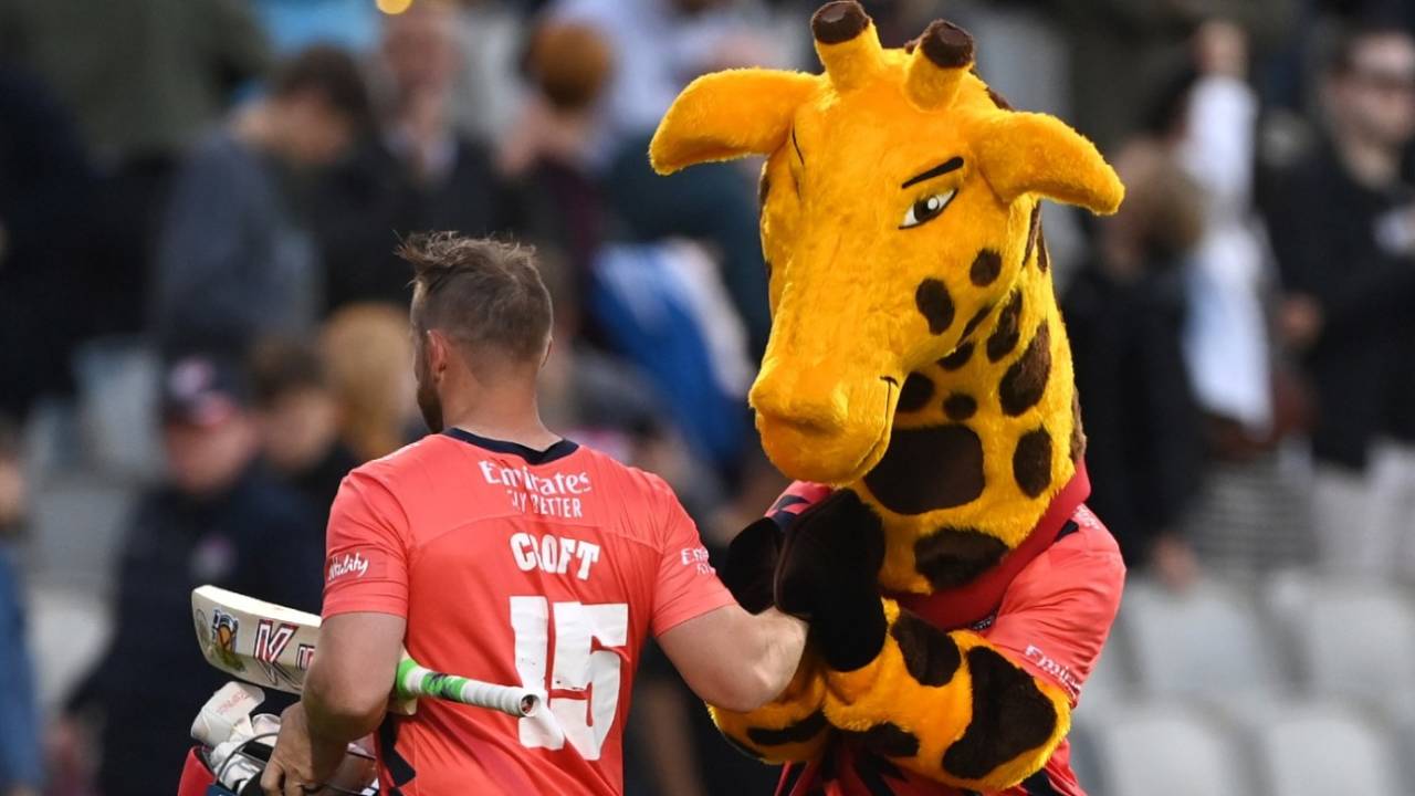 Steven Croft is congratulated by Lanky the Giraffe after securing Lancashire's Finals Day berth, Lancashire vs Essex, Vitality Blast, Old Trafford, July 8, 2022