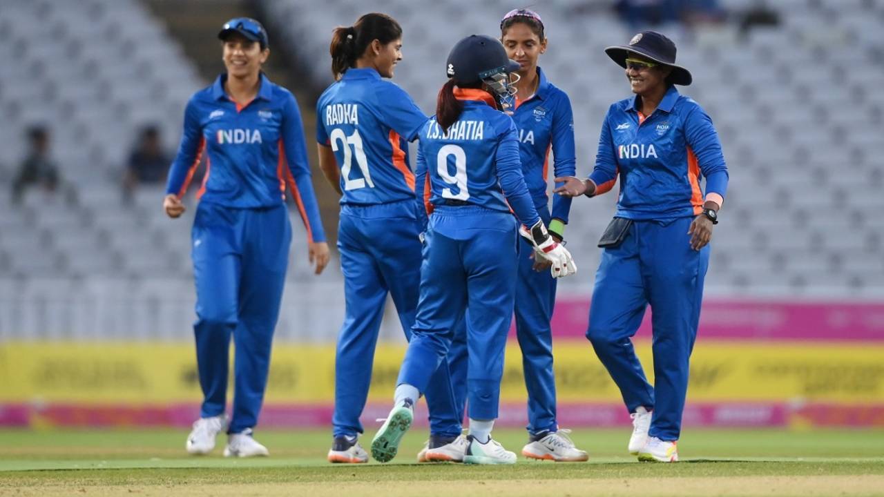 The Indian team gathers around Radha Yadav to celebrate a wicket, Barbados vs India, Commonwealth Games 2022, Birmingham, August 3, 2022
