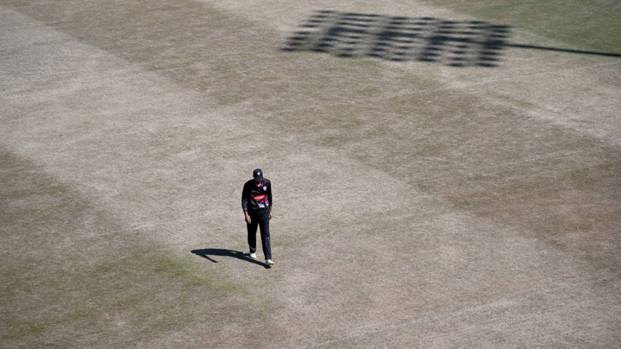 Andrew Umeed walks across a parched Leicester outfield during England's worst drought for nearly 30 years&nbsp;&nbsp;&bull;&nbsp;&nbsp;Getty Images