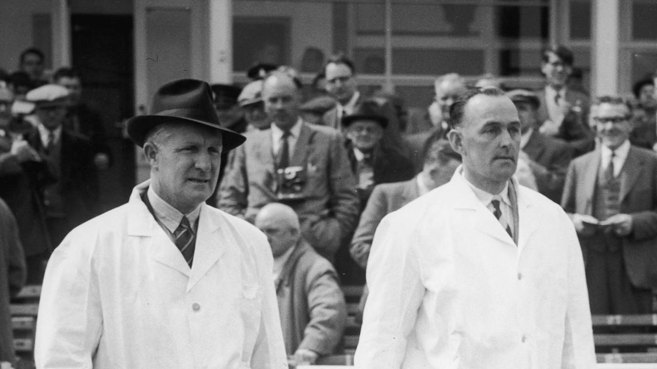 Umpires Emrys Davies and Charlie Elliott walk out on to the field, West Indies tour of England, 1957