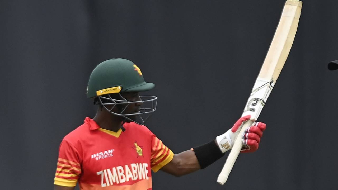 Wessly Madhevere raises his blade after his half-century, Australia vs Zimbabwe, 1st ODI, Townsville, August 28, 2022