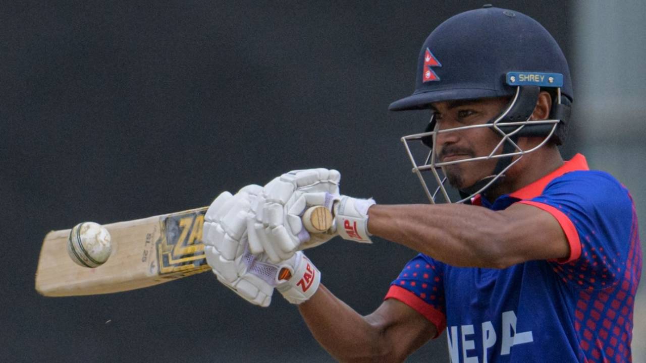 Rohit Paudel punches away a short and wide delivery&nbsp;&nbsp;&bull;&nbsp;&nbsp;AFP/Getty Images