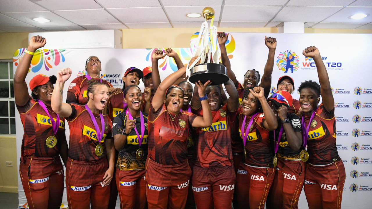 The Trinbago Knight Riders players celebrate with the trophy, Barbados Royals vs Trinbago Knight Riders, Women's CPL final, Basseterre, September 4, 2022