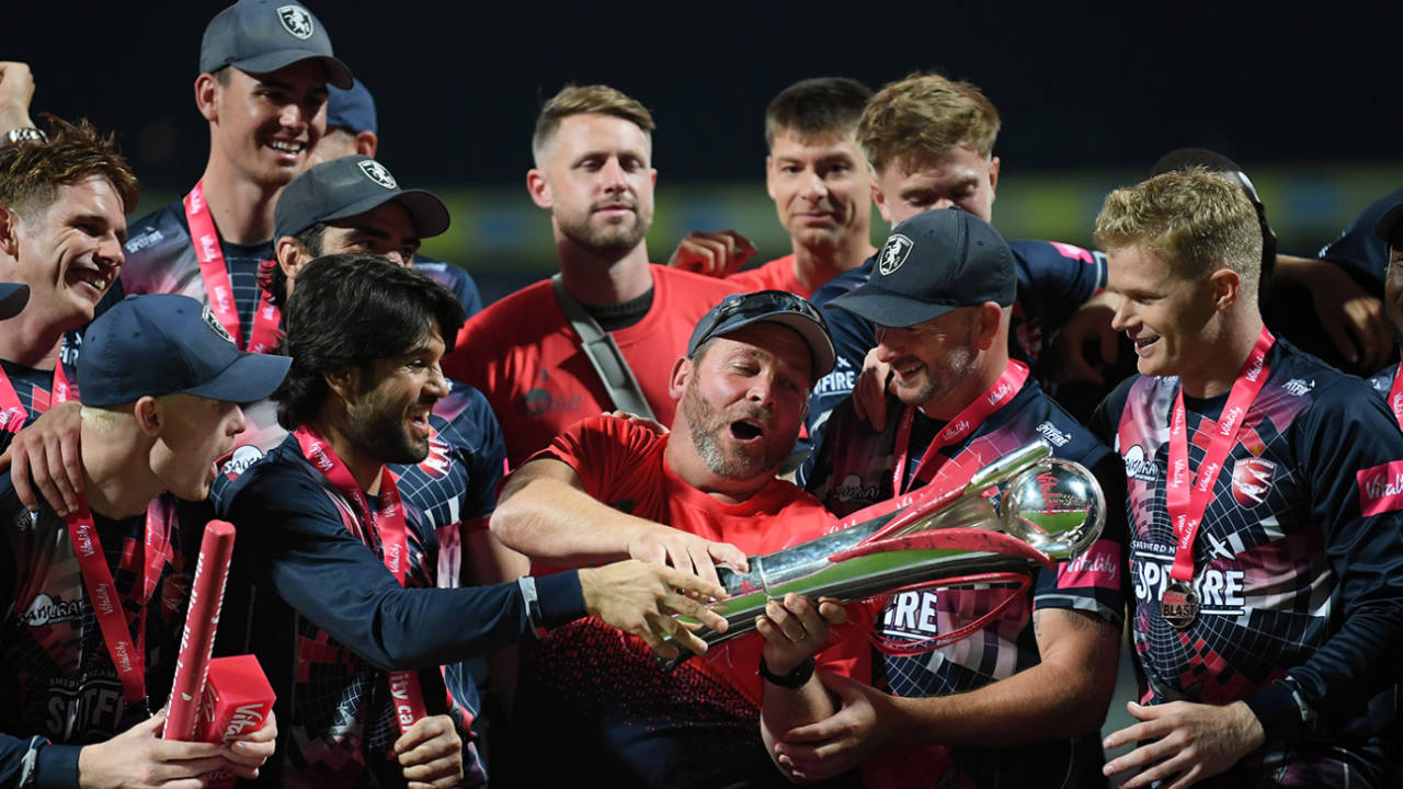 Kent captain Sam Billings (right) Darren Stevens (second from right) watch coach Max Walker hold the trophy, Somerset vs Kent, Final, Vitality T20 Blast Finals Day, Edgbaston, September 18, 2021