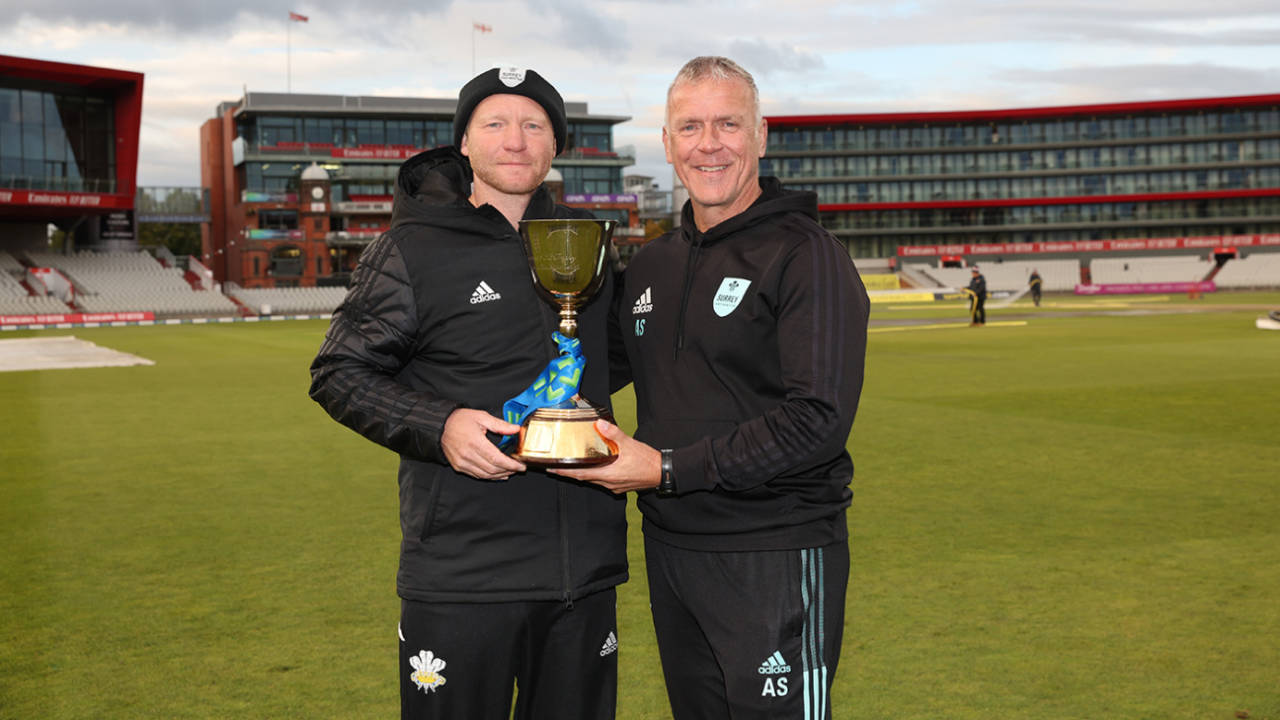 Gareth Batty and Alec Stewart pose with the Championship trophy&nbsp;&nbsp;&bull;&nbsp;&nbsp;Getty Images