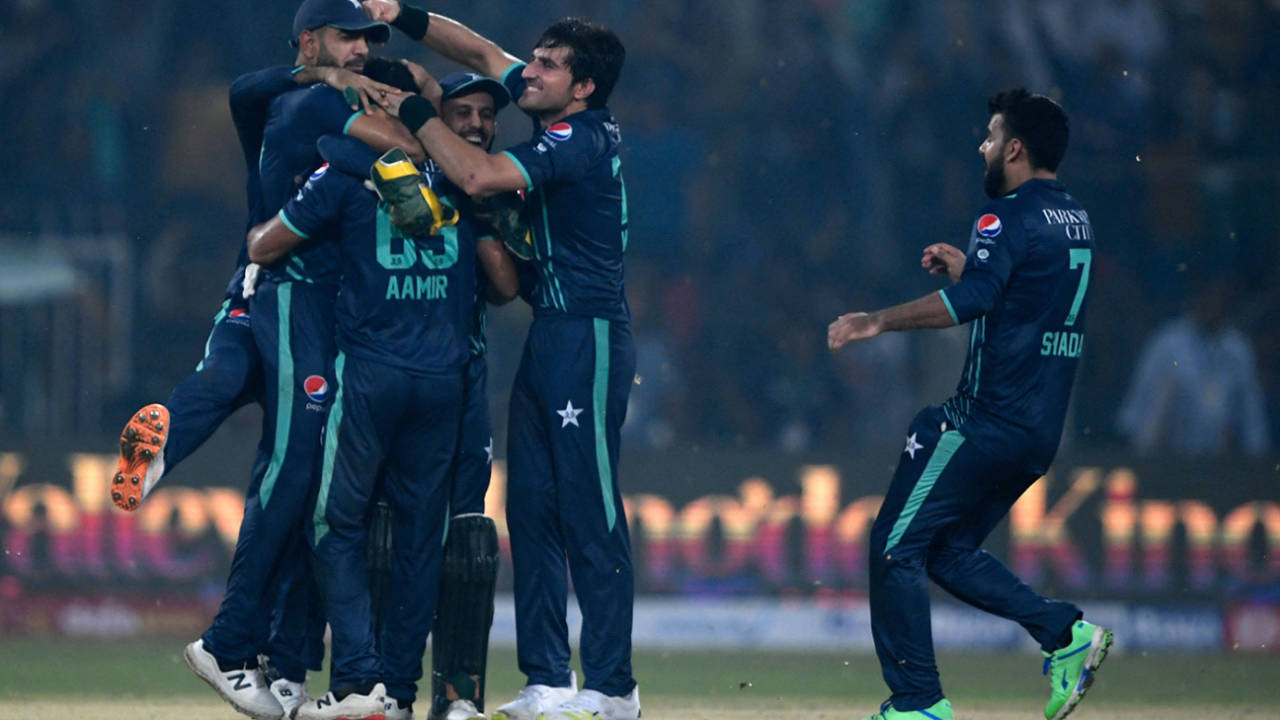 Aamer Jamal is mobbed after closing out victory in the fifth T20I&nbsp;&nbsp;&bull;&nbsp;&nbsp;AFP/Getty Images