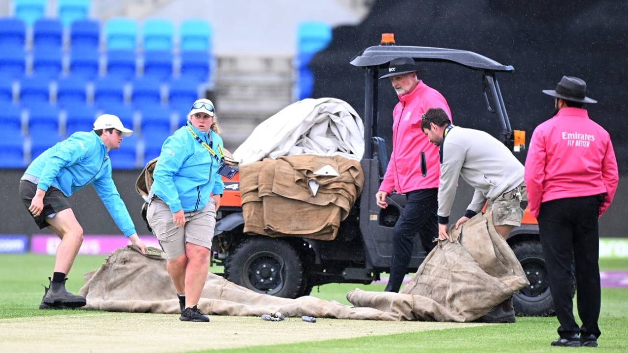 The groundstaff rushes on to get the covers on following a drizzle, West Indies vs Scotland, Men's T20 World Cup 2022, First round, Group B, Hobart, October 17, 2022