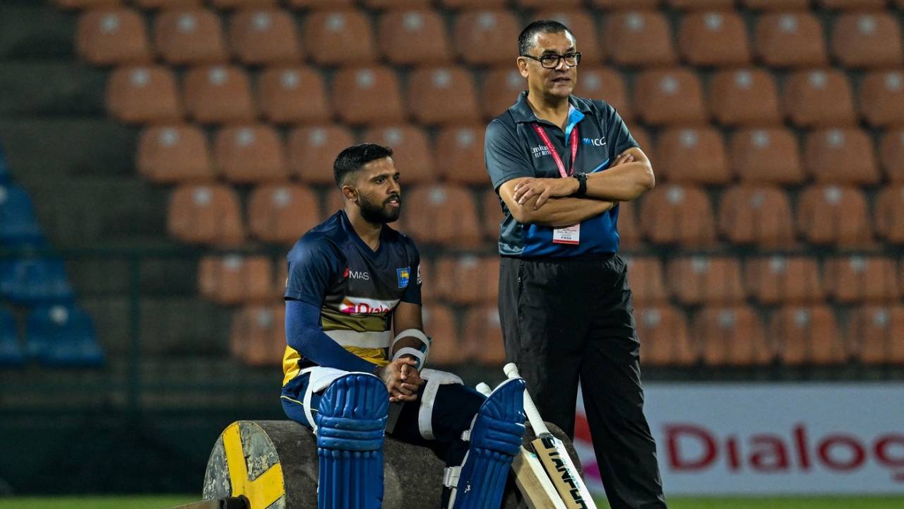 Kusal Mendis and ICC match referee Ranjan Madugalle observe a practice session, Pallekele, November 23, 2022