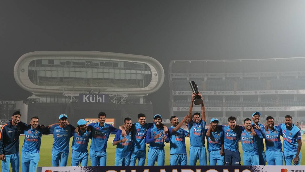 Mukesh Kumar has the trophy as India pose after beating Sri Lanka, India vs Sri Lanka, 3rd T20I, Rajkot, January 7, 2023
