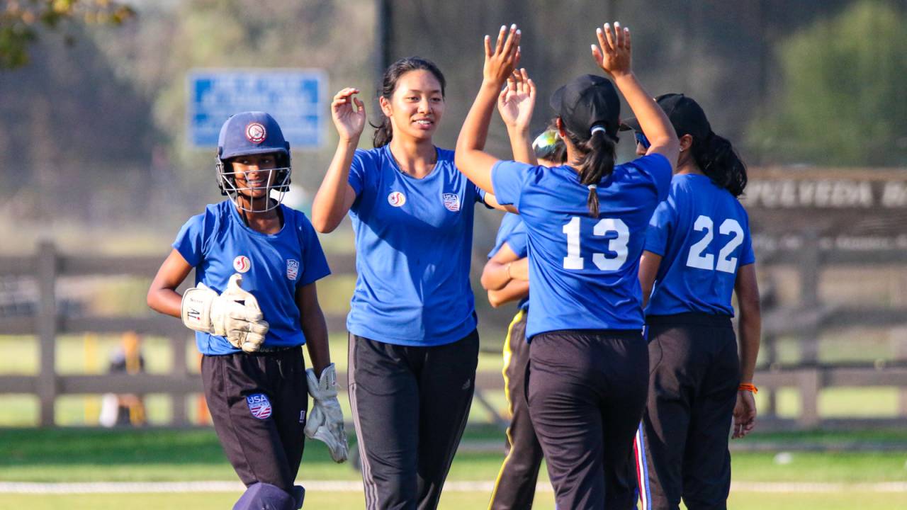Medium pacer Jivana Aras gets a high five after taking a wicket at the 2022 USA Cricket Women's U19 National Championship, Los Angeles, October 11, 2022