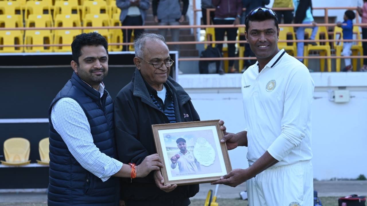 Kamlesh Makwana collects a memento after retiring from all formats