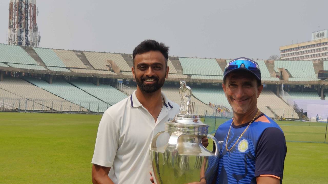 Saurashtra's proud captain and coach: Jaydev Unadkat and Niraj Odedra pose with the Ranji Trophy, Bengal vs Saurashtra, Ranji Trophy 2022-23 final, Kolkata, 4th day, February 19, 2023