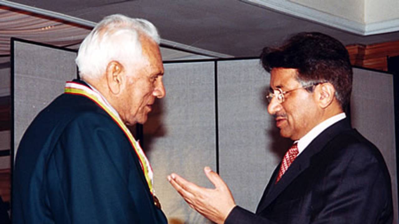 Khan Mohammad receiving his medal from Pakistan president during the Golden Jubilee of Test Cricket Gala, Islamabad, September 16, 2003.