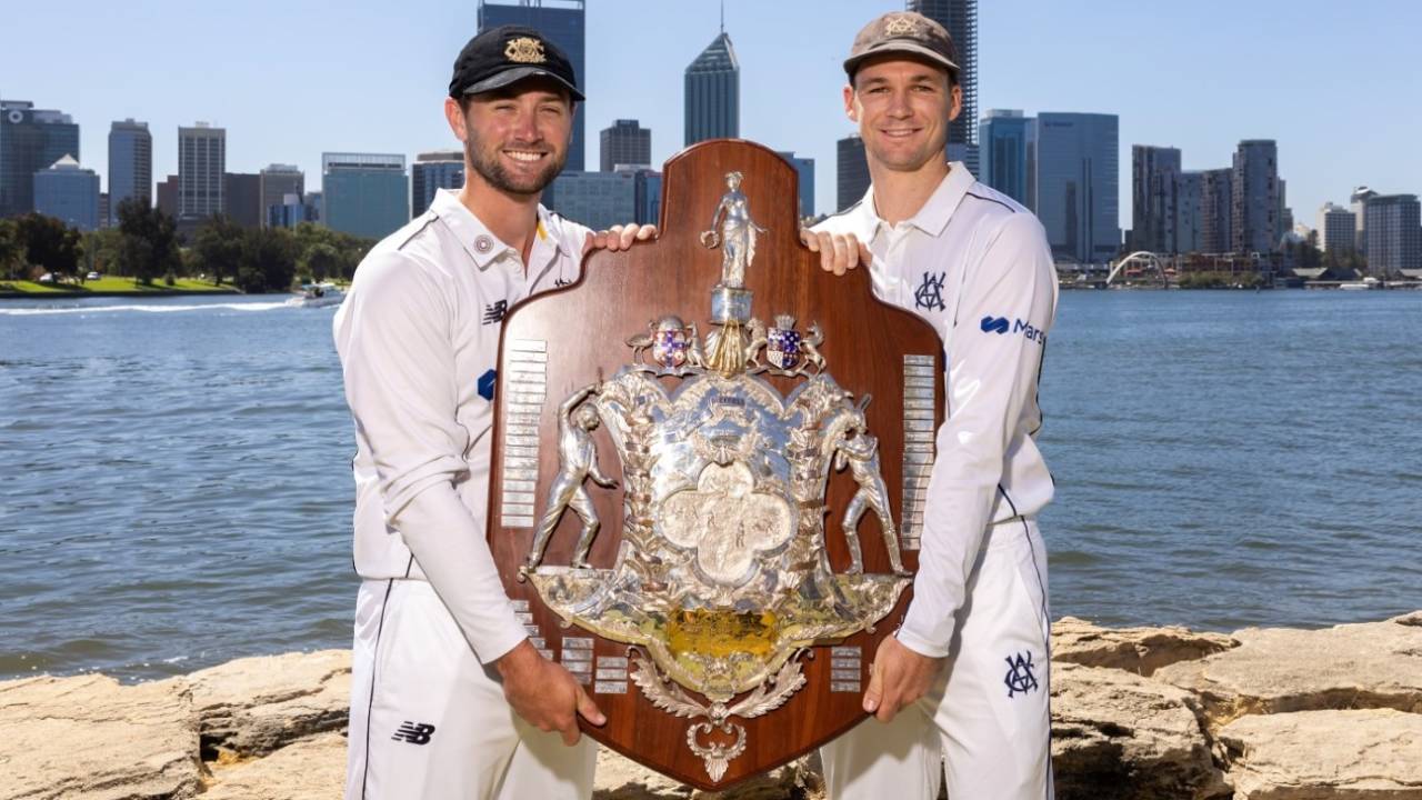 Sam Whiteman and Peter Handscomb pose with the Sheffield Shield trophy prior to the final