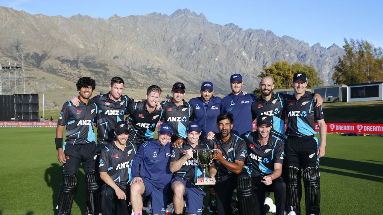 New Zealand's players pose with the trophy after completing a 2-1 series win